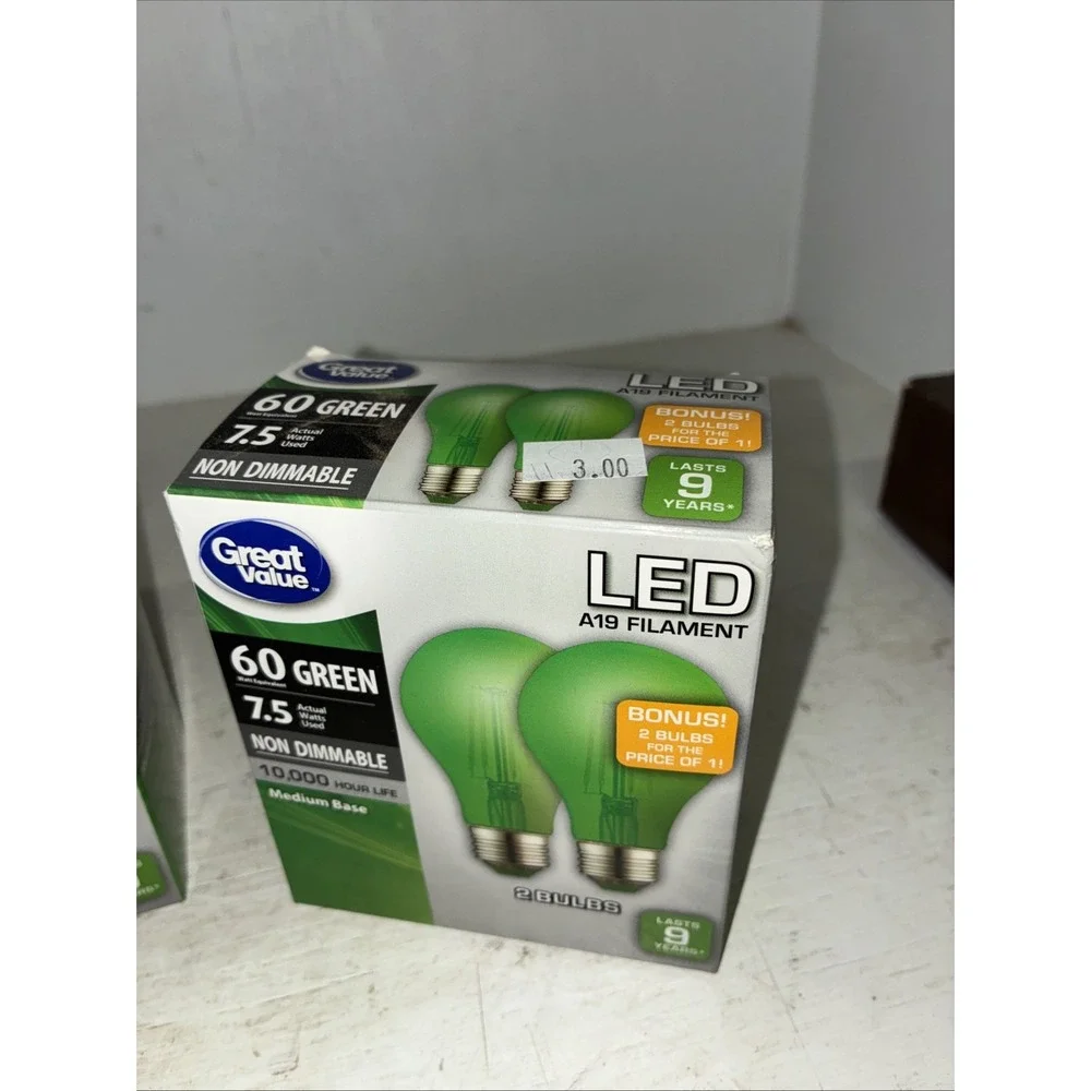 two packs of green great value LED 60 watt light bulbs A19 4 Bulbs NIB